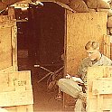 Lt. Terry Harvick on the "porch" of the finished hootch. Nearly all the comforts of home.  We had a refrigerataor, fan, electric lights and a land line to the FDC.